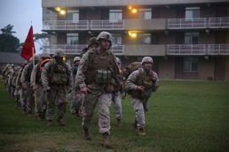 Integrated Task Force artillery Marines step off for hike