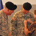 Wife pins on husband's brigadier general rank