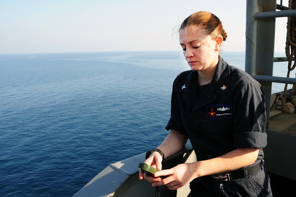 George H.W. Bush sailor measures temperature