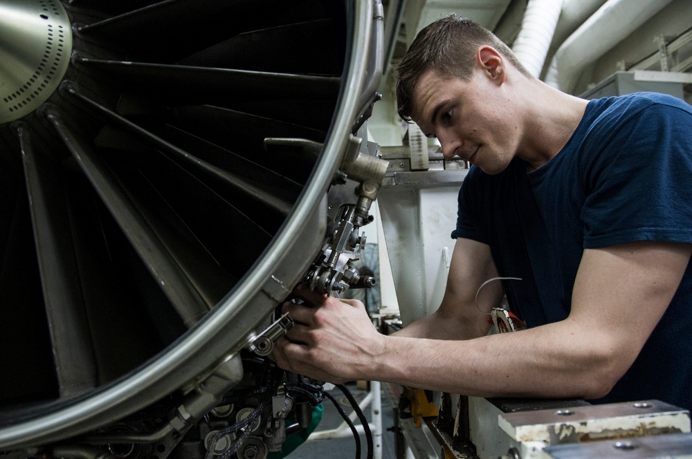 USS George H.W. Bush sailor performs maintenance