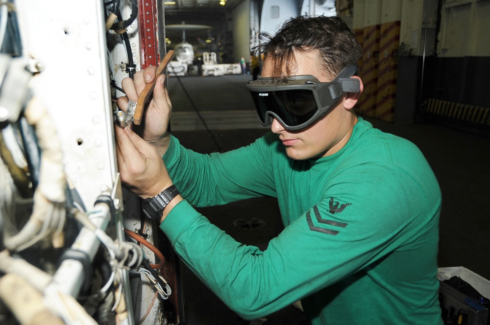 Sailor performs maintenance aboard USS George H.W. Bush