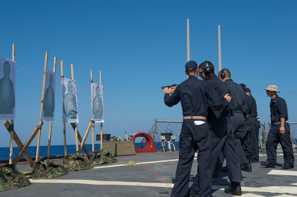 USS Cole Sailors conduct small arms qualification training