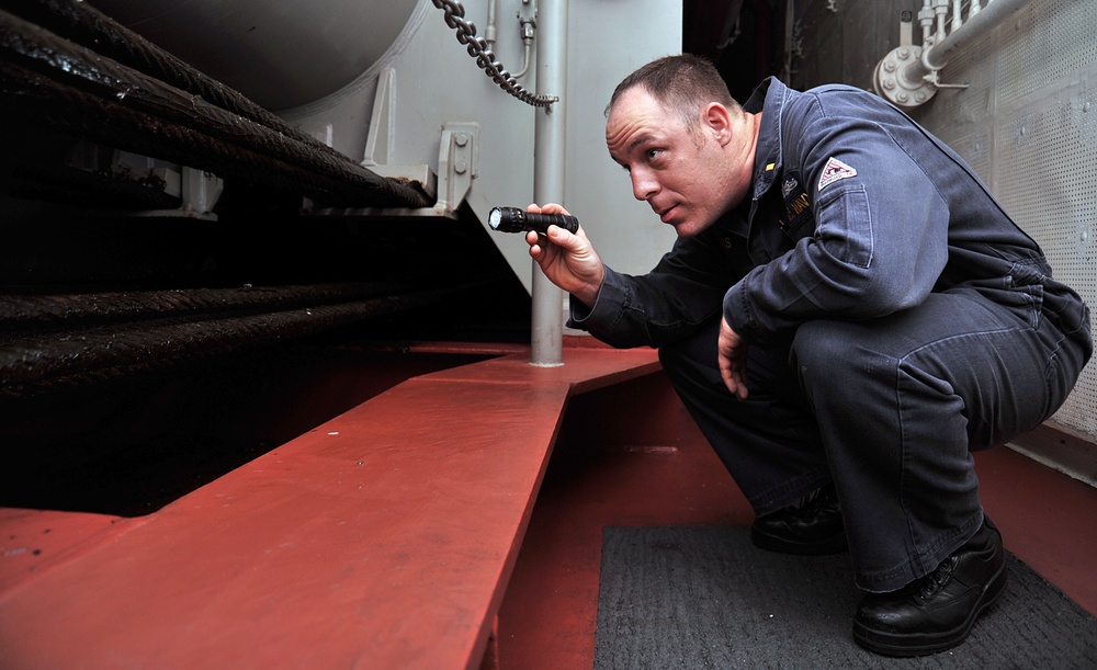 USS George H.W. Bush officer inspects elevator wires