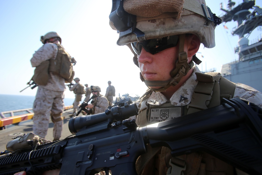 Marine performs remedial action for his weapon