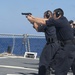 USS Cole Sailors conduct small-arms qualification training