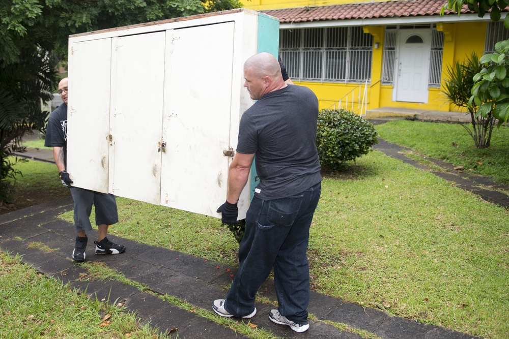 USS Vandegrift sailors move cabinets