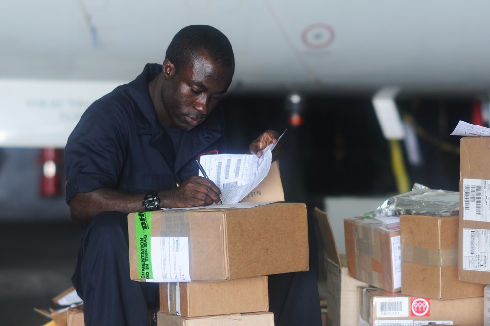 USS George H.W. Bush Sailor organizes supplies