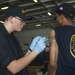 USS Carl Vinson Sailor receives flu vaccine