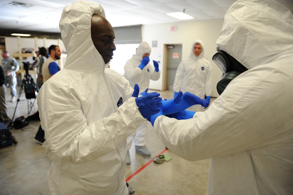 Fort Hood engineer troops prep with PPE for Liberia mission, governor visits
