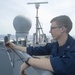 USS Peleliu Sailor takes weather observation