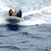 USS Dewey rigid-hull inflatable boat team approaches USS Bunker Hill