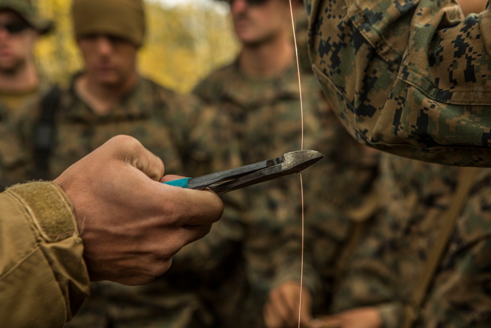 CLB-6 and 2/5 Marines receive classes on traps and snares at Mountain Warfare Training Center