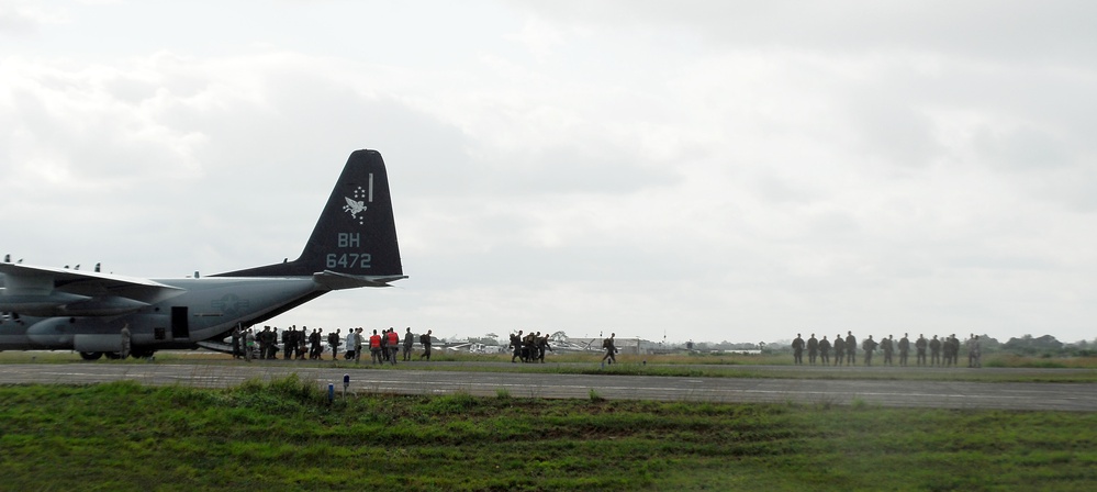 Newly arrived Marines exiting KC-130 in support of Operation United Assistance