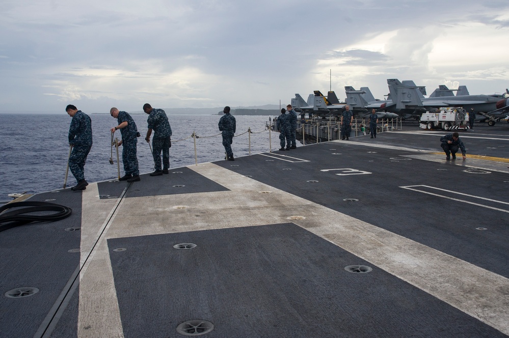 USS George Washington Sailors prepare safety lines