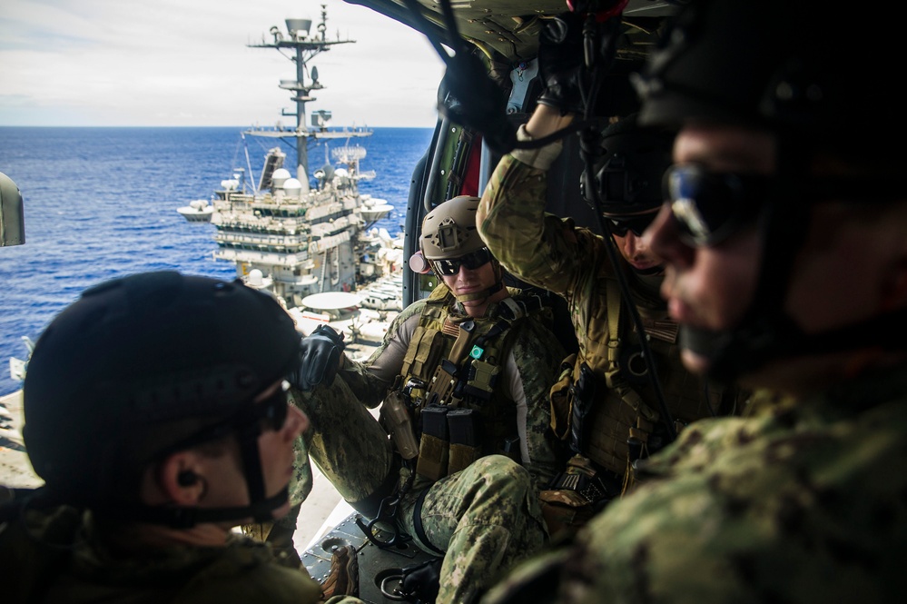 EOD Sailors prepare to rappel aboard USS George Washington