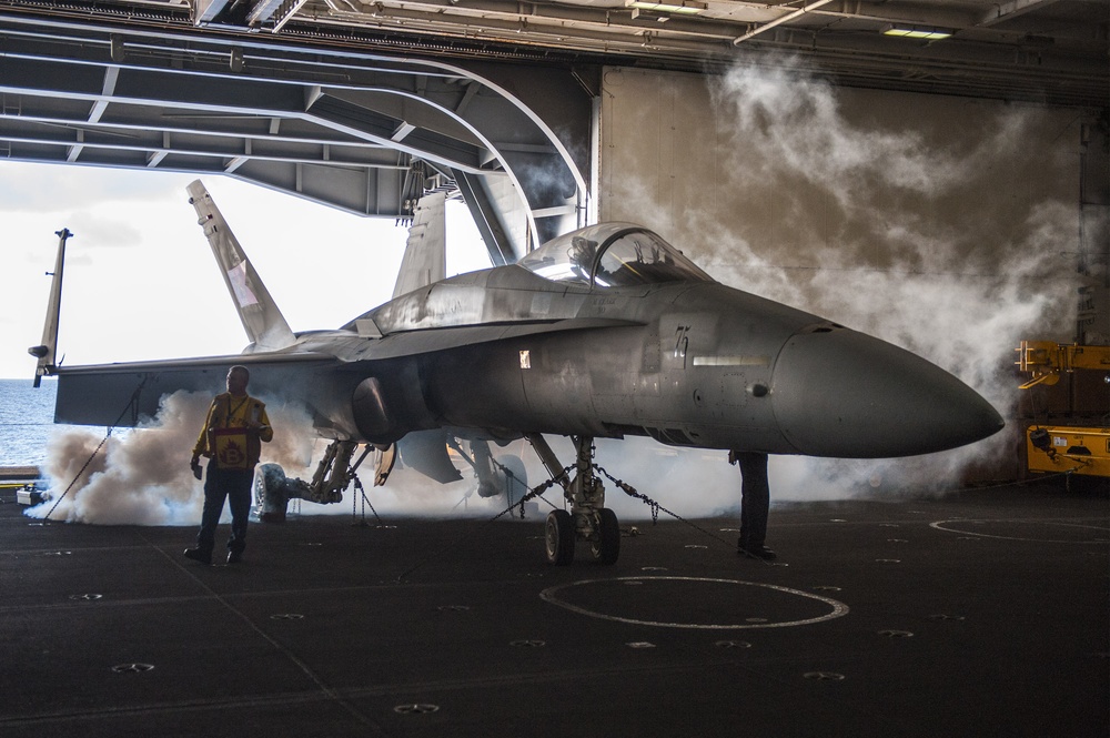 USS Harry S. Truman Sailor marks a simulated aircraft fire