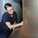 USS George H.W. Bush sailor at work