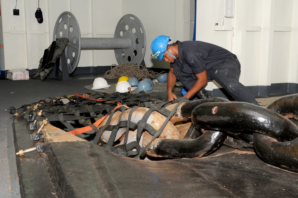 USS George H.W. Bush sailor at work