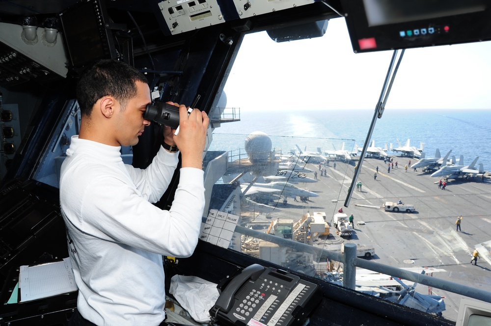 USS George H.W. Bush Sailor observes flight operations