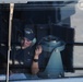 USS George H.W. Bush Sailor stands phone talker watch