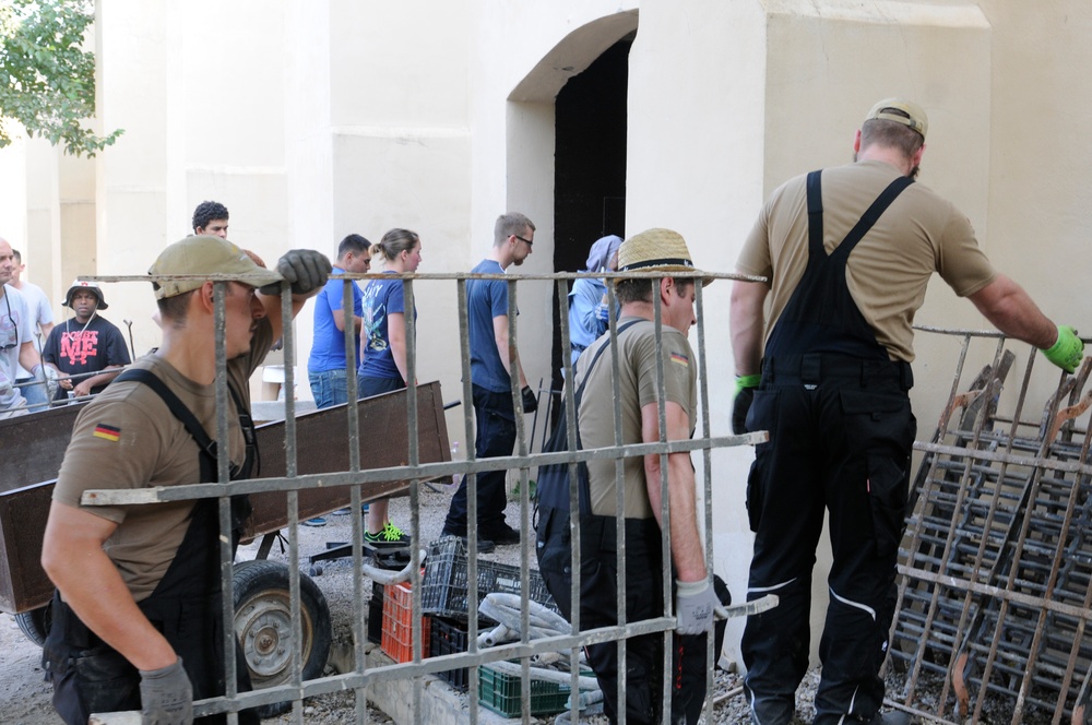 Seabees from NMCB 133 Detail Rota help Spanish monastery alongside with US, German and Turkish Sailors