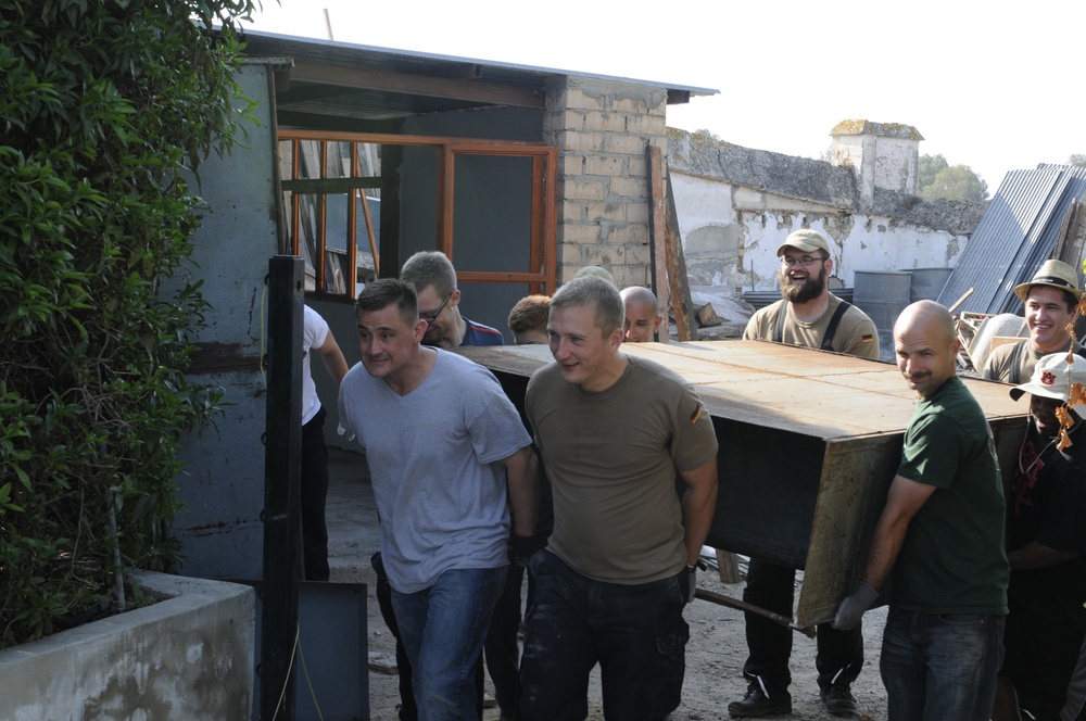 Seabees from NMCB 133 Detail Rota help Spanish monastery alongside with US, German and Turkish Sailors