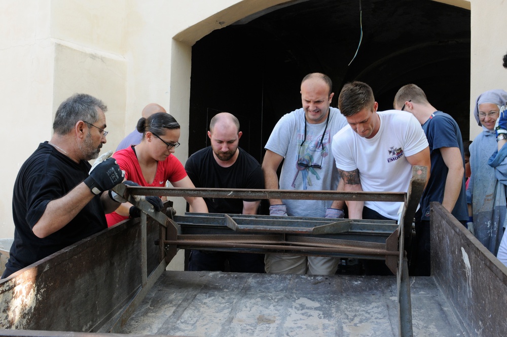 Seabees from NMCB 133 Detail Rota help Spanish monastery alongside with US, German and Turkish Sailors