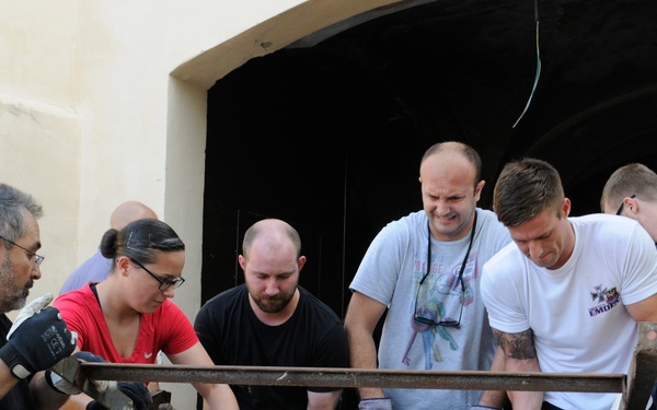 Seabees from NMCB 133 Detail Rota help Spanish monastery alongside with US, German and Turkish Sailors