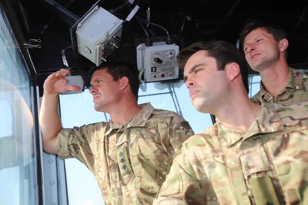 British service members tour USS Makin Island