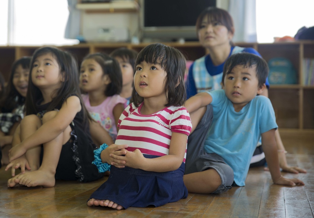 Marines teach English to Okinawa students through song, play during new program