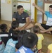 Marines teach English to Okinawa students through song, play during new program