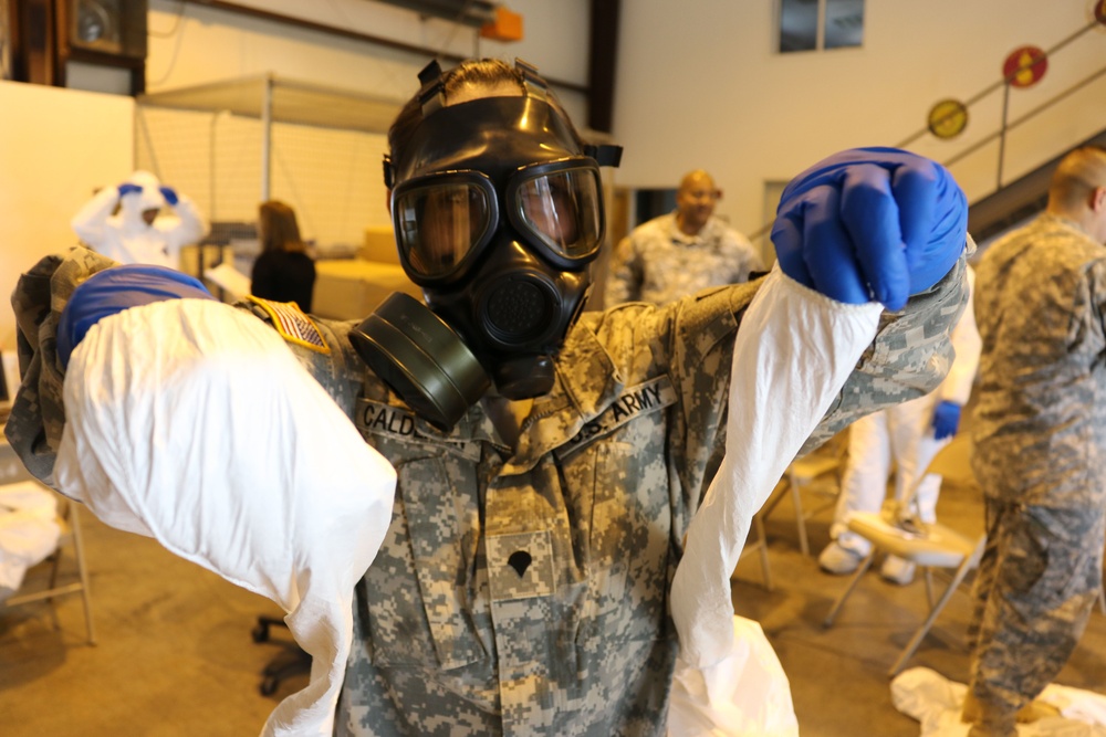 Soldiers practice decontamination and removal