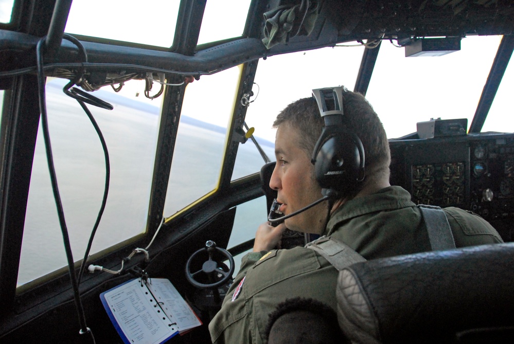 Coast Guard HC-130 Hercules aircrew conducts first light search and rescue operations over Cook Inlet, Alaska