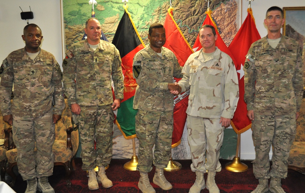 Soldiers and civilians receive coins from chief of engineers, Lt. Gen. Bostick