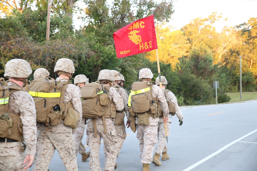 Headquarters and Service Company Marines reach foundations of combat conditioning through hiking
