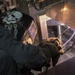 USS Dewey Sailor welds an oven
