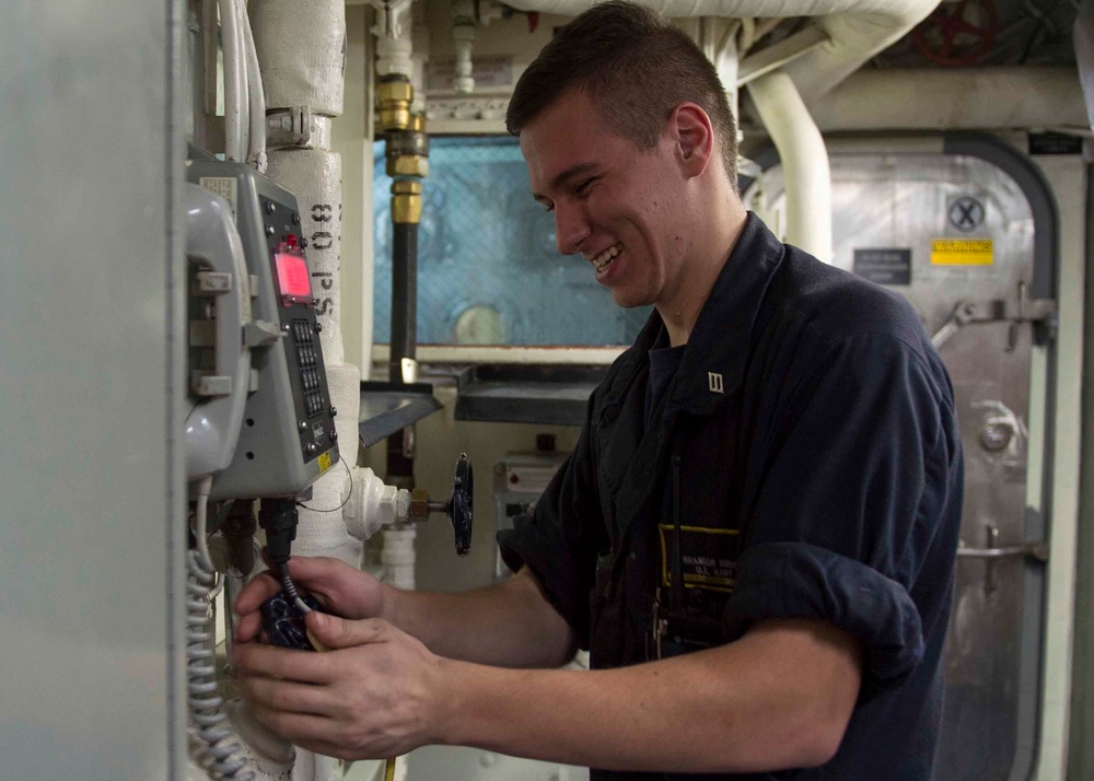 USS Dewey Sailors test water valves