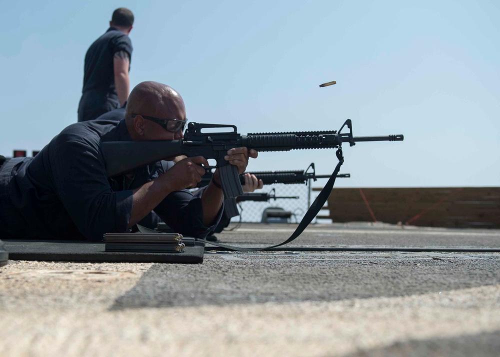 USS Dewey Sailors conduct small arms qualification