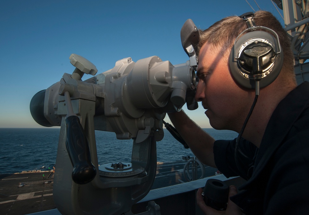USS Carl Vinson Sailor searches for surface contacts