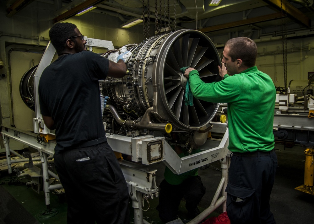 USS Carl Vinson Sailors clean jet engine