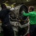 USS Carl Vinson Sailors clean jet engine