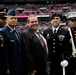 US service members present US flag at NFL game