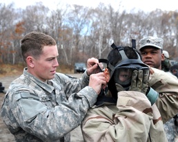 US Army Soldiers display chemical protective equipment during Orient Shield 14