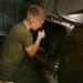 Lance Cpl. Garrett J. Burke fixes the pulper aboard the USS Makin Island