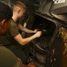 Lance Cpl. Garrett J. Burke fixes the pulper aboard the USS Makin Island