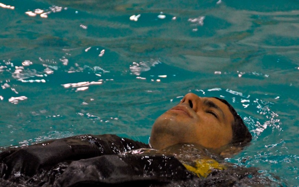 Coast Guard air crew members undergo annual wet drills testing at Air Station Kodiak, Alaska