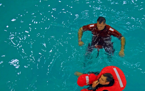 Coast Guard air crew members undergo annual wet drills testing at Air Station Kodiak, Alaska