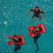 Coast Guard air crew members undergo annual wet drills testing at Air Station Kodiak, Alaska