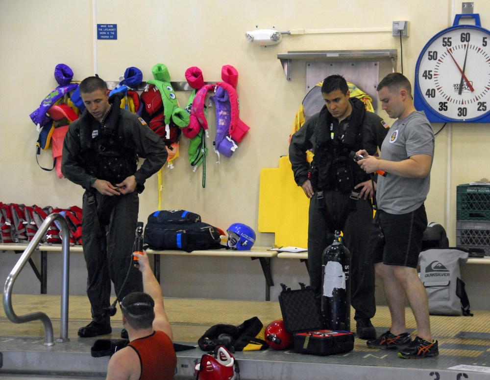 Coast Guard air crew members undergo annual wet drills testing at Air Station Kodiak, Alaska
