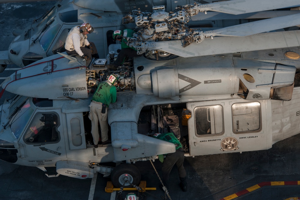 Sailors conduct Seahawk maintenance aboard USS Carl Vinson